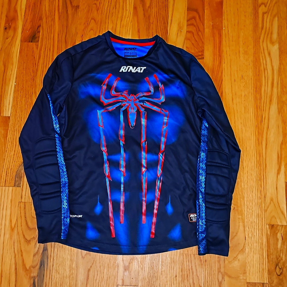 Goalie jersey with forearm pads.